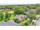 Aerial view of a landscaped home showcasing its architectural design and mature trees at 4905 Emilee Grace Ln, St Cloud, FL 34771
