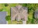 Aerial view of home showcasing roof, landscaping, and surrounding greenery at 4905 Emilee Grace Ln, St Cloud, FL 34771