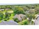 Aerial view of a landscaped home showcasing its architectural design and mature trees at 4905 Emilee Grace Ln, St Cloud, FL 34771