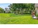 Sprawling backyard with lush green grass and mature trees at 4905 Emilee Grace Ln, St Cloud, FL 34771