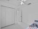 A secondary bedroom features a closet and a view into the hall at 4905 Emilee Grace Ln, St Cloud, FL 34771