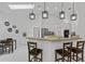 Kitchen view of breakfast bar with seating, stainless appliances, and eat-in area at 4905 Emilee Grace Ln, St Cloud, FL 34771