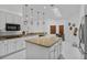 Kitchen with island, breakfast bar, stainless steel appliances, and an eat-in area at 4905 Emilee Grace Ln, St Cloud, FL 34771