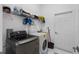 Laundry room with front loading washer and dryer and wire shelf for storage at 4905 Emilee Grace Ln, St Cloud, FL 34771