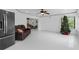 Bright and open living area with tiled floors and a lovely green tree accent at 4905 Emilee Grace Ln, St Cloud, FL 34771