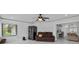 Bright and spacious living room with neutral color pallet, stainless appliances, and tiled flooring at 4905 Emilee Grace Ln, St Cloud, FL 34771