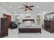 Spacious main bedroom with a ceiling fan, decorative furnishings, and lots of natural light at 4905 Emilee Grace Ln, St Cloud, FL 34771