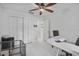 Bright office space with a ceiling fan, a large window, and modern decor at 4905 Emilee Grace Ln, St Cloud, FL 34771