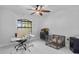 Bright office space with a ceiling fan, a large window, and modern decor at 4905 Emilee Grace Ln, St Cloud, FL 34771