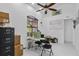 Bright office space with a ceiling fan, a large window, and modern decor at 4905 Emilee Grace Ln, St Cloud, FL 34771