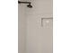 Clean, white-tiled shower featuring a rainfall shower head and built in niche at 4905 Emilee Grace Ln, St Cloud, FL 34771