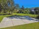 Outdoor basketball court with a well-maintained surface and hoop surrounded by green space at 529 Quail Down Dr, Debary, FL 32713