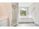 Bright bathroom with glass enclosed shower and tiled tub at 529 Quail Down Dr, Debary, FL 32713