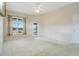 Bedroom features carpet, a window and a door leading to the lanai at 529 Quail Down Dr, Debary, FL 32713