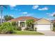 Charming single-story home with well-manicured lawn, mature landscaping, and two car garage at 529 Quail Down Dr, Debary, FL 32713