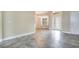 A bright foyer with decorative glass front door, gray tile flooring, and neutral paint at 529 Quail Down Dr, Debary, FL 32713