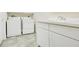 Laundry room includes a washer, dryer, and a sink with cabinet storage at 529 Quail Down Dr, Debary, FL 32713