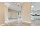 An open concept living room with views into the kitchen, tile floor, and natural lighting at 529 Quail Down Dr, Debary, FL 32713