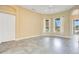 Bright living room with tile flooring, large windows, ceiling fan, and neutral wall color at 529 Quail Down Dr, Debary, FL 32713