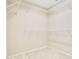 Walk-in closet has white wire shelving and neutral walls at 529 Quail Down Dr, Debary, FL 32713