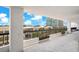 This balcony features decorative flower boxes and an open view to the exterior landscaping at 530 E Central Blvd # 406, Orlando, FL 32801