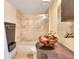 Well-appointed bathroom featuring a unique sink bowl, modern vanity and a glass shower door at 530 E Central Blvd # 406, Orlando, FL 32801