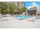 Relaxing community pool with ample lounge chairs for residents at 530 E Central Blvd # 406, Orlando, FL 32801