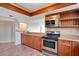 Well-equipped kitchen with granite countertops and stainless steel appliances offers a functional layout at 530 E Central Blvd # 406, Orlando, FL 32801