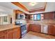 This beautifully designed kitchen features stainless steel appliances, granite counters, and stylish wood cabinets at 530 E Central Blvd # 406, Orlando, FL 32801