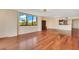 Spacious living room with hardwood floors and natural light streaming through a large window at 530 E Central Blvd # 406, Orlando, FL 32801