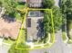 A bright view of a home featuring a screened pool and efficient solar panels, situated in a vibrant locale at 533 Pickfair Ter, Lake Mary, FL 32746