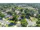 A clean home with solar panels and screened pool in a leafy neighborhood highlighted with a yellow outline at 533 Pickfair Ter, Lake Mary, FL 32746