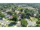 Overhead view of a house with solar panels and a screen enclosed pool, nestled in a lush neighborhood at 533 Pickfair Ter, Lake Mary, FL 32746
