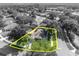 A charming home is outlined in yellow, nestled amongst mature trees in a peaceful residential neighborhood at 533 Pickfair Ter, Lake Mary, FL 32746