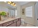Clean bathroom featuring a single sink vanity, tiled floor, and white toilet at 533 Pickfair Ter, Lake Mary, FL 32746