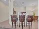 Eat-in kitchen featuring counter seating, stainless steel appliances, and a nearby dining area at 533 Pickfair Ter, Lake Mary, FL 32746