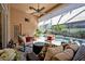 Cozy screened lanai with comfortable seating overlooking the pool, blending indoor-outdoor living at 533 Pickfair Ter, Lake Mary, FL 32746