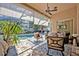 Inviting screened lanai with stylish furniture and a view of the refreshing pool area at 533 Pickfair Ter, Lake Mary, FL 32746