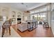 Spacious living room with hardwood floors, stylish decor, and lots of natural light at 533 Pickfair Ter, Lake Mary, FL 32746