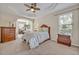 Spacious main bedroom features a ceiling fan, tray ceiling and an attached study at 533 Pickfair Ter, Lake Mary, FL 32746