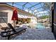 Relaxing poolside with comfortable chaise lounges and lush landscaping, perfect for outdoor living at 533 Pickfair Ter, Lake Mary, FL 32746