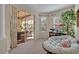 Sun-filled study with open access to a covered patio through sliding glass doors at 533 Pickfair Ter, Lake Mary, FL 32746