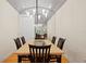 Stylish dining room with unique lighting, vaulted ceiling and hardwood floors at 548 S Hyer Ave # 1, Orlando, FL 32801