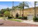 Beautiful exterior of the building with lush landscaping, mature trees and a paved red brick street at 548 S Hyer Ave # 1, Orlando, FL 32801