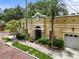 Attractive exterior of the building with nice landscaping, mature trees and a paved red brick street at 548 S Hyer Ave # 1, Orlando, FL 32801
