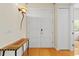 Spacious foyer featuring double doors, hardwood floors, and an accent table with elegant lighting at 548 S Hyer Ave # 1, Orlando, FL 32801