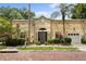 Charming single-story home with lush landscaping, palm trees, and a welcoming entrance at 548 S Hyer Ave # 1, Orlando, FL 32801
