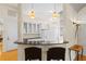Modern kitchen features updated white cabinets, contrasting counters and stylish pendant lighting at 548 S Hyer Ave # 1, Orlando, FL 32801