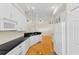Eat-in kitchen with white cabinets, stainless appliances and breakfast bar for dining at 548 S Hyer Ave # 1, Orlando, FL 32801