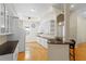 Bright kitchen boasts white cabinetry, breakfast bar and modern appliances at 548 S Hyer Ave # 1, Orlando, FL 32801